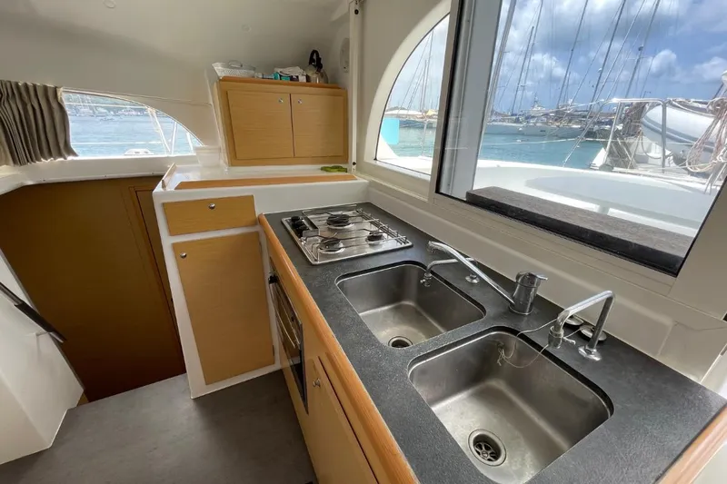 Carnabie Yacht Photos Pics Interior of 2014 Lagoon 380 S2 yacht kitchen with dual sinks and stove.