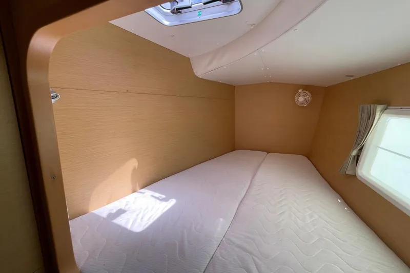 Carnabie Yacht Photos Pics Interior cabin of 2014 Lagoon 380 S2 catamaran with bed and window.