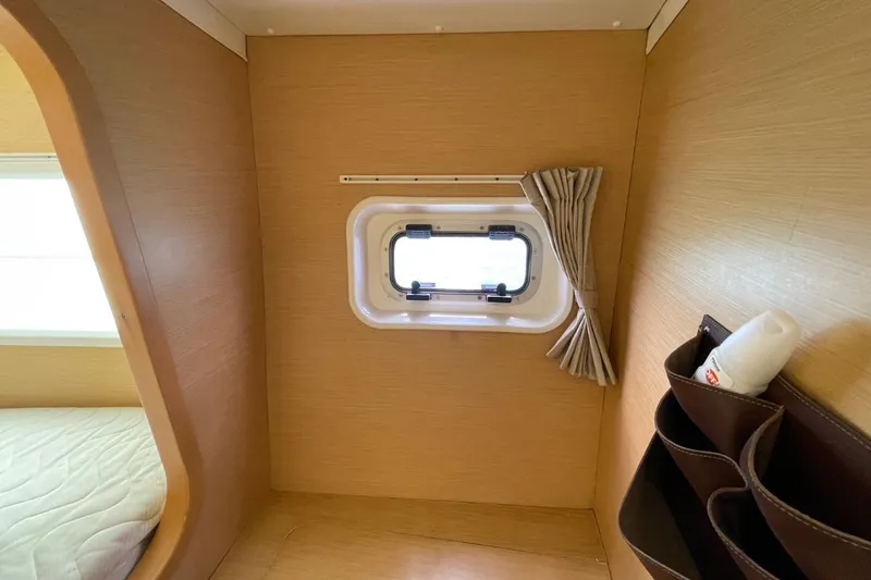 Carnabie Yacht Photos Pics Interior cabin of 2014 Lagoon 380 S2 with window and storage pockets.