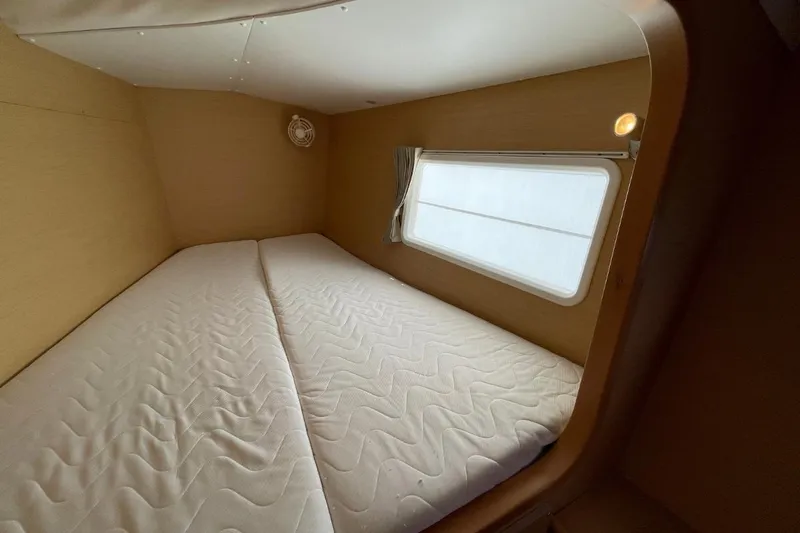 Carnabie Yacht Photos Pics Interior cabin of 2014 Lagoon 380 S2 catamaran with twin beds and window.