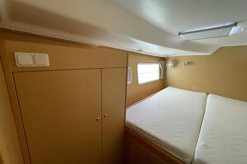 Carnabie Yacht Photos Pics Interior cabin of 2014 Lagoon 380 S2 catamaran with bed and storage.