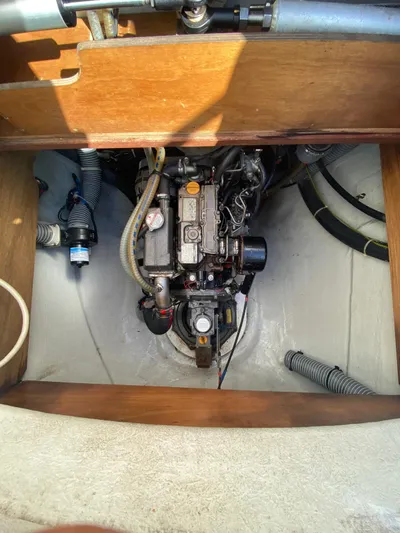 Carnabie Yacht Photos Pics Engine compartment of a 2014 Lagoon 380 S2 catamaran, showcasing mechanical components.