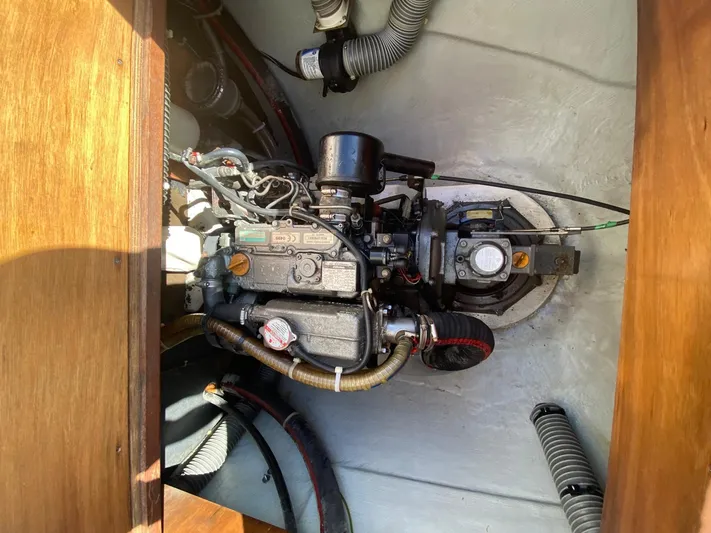 Carnabie Yacht Photos Pics Engine compartment of a 2014 Lagoon 380 S2 catamaran, showcasing mechanical components.