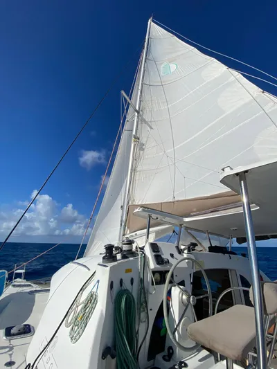 Carnabie Yacht Photos Pics Sailing on a 2014 Lagoon 380 S2 catamaran under clear blue skies.