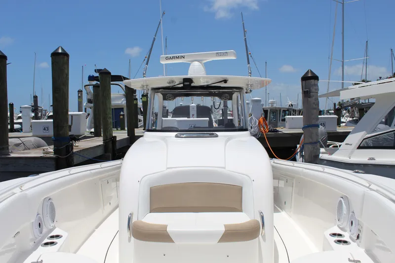  Yacht Photos Pics 2016 Edgewater 370CC boat docked at marina under clear blue sky.