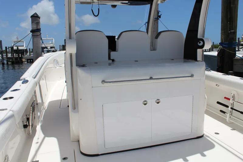  Yacht Photos Pics 2016 Edgewater 370CC boat interior with seating and storage, docked at marina.