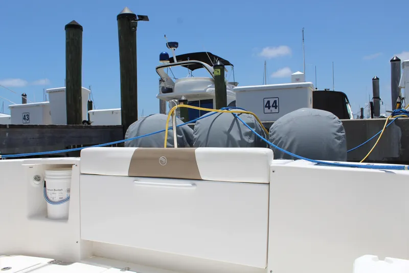  Yacht Photos Pics 2016 Edgewater 370CC boat docked at marina with blue skies.