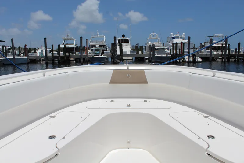  Yacht Photos Pics Bow view of 2016 Edgewater 370CC boat docked at marina under blue sky.