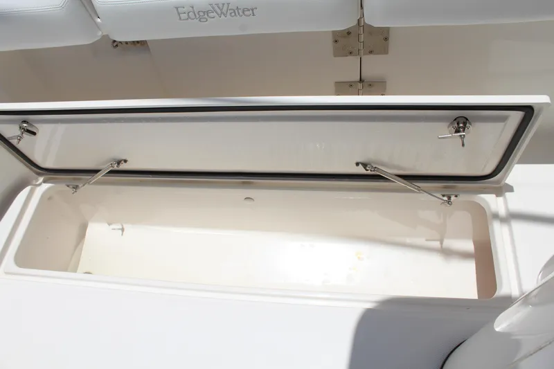  Yacht Photos Pics Open storage compartment on 2016 Edgewater 370CC boat, featuring stainless steel hinges.