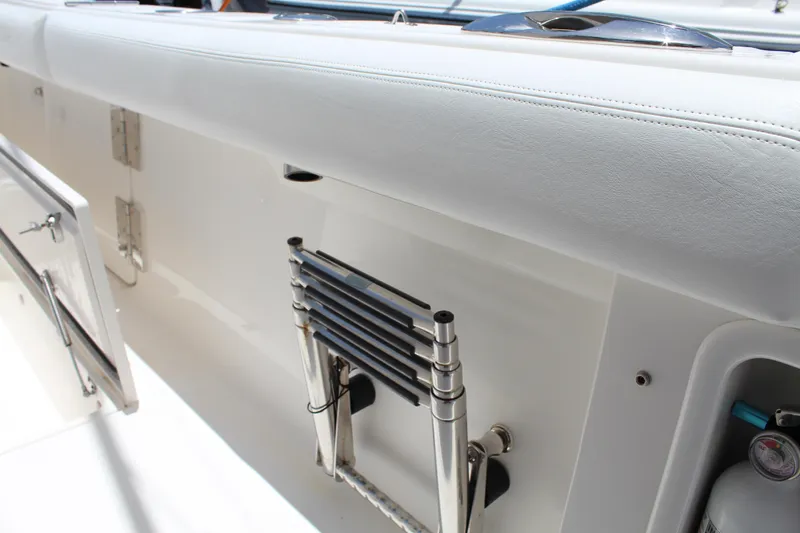  Yacht Photos Pics 2016 Edgewater 370CC boat interior with foldable ladder and storage compartment.