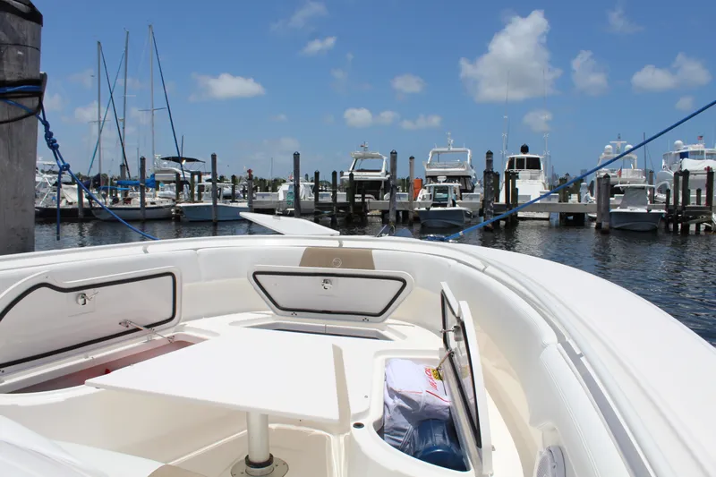  Yacht Photos Pics 2016 Edgewater 370CC boat docked at marina under clear blue sky.