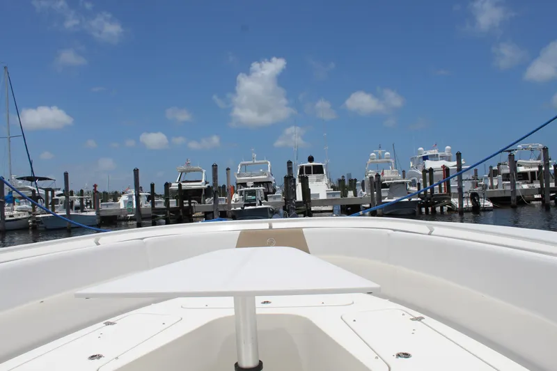  Yacht Photos Pics 2016 Edgewater 370CC boat docked at marina under clear blue sky.