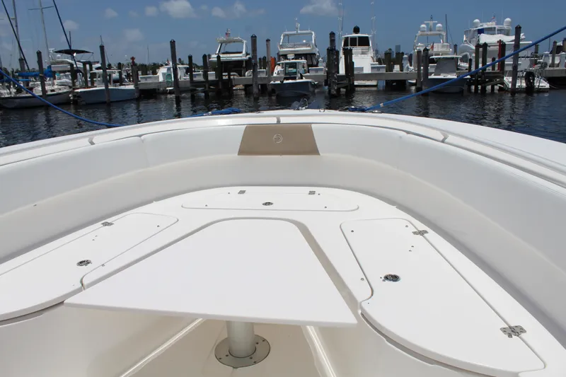  Yacht Photos Pics 2016 Edgewater 370CC boat interior at marina, showcasing spacious deck and seating area.