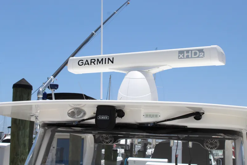  Yacht Photos Pics Edgewater 370CC 2016 boat with Garmin xHD2 radar system under clear blue sky.