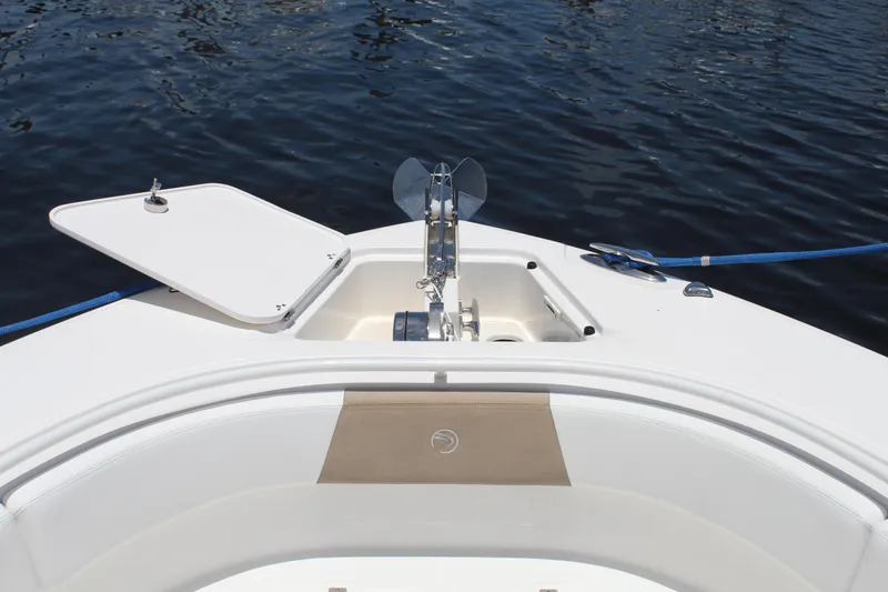  Yacht Photos Pics Bow of 2016 Edgewater 370CC boat with anchor and open hatch on calm water.
