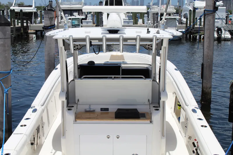  Yacht Photos Pics 2016 Edgewater 370CC boat docked at marina, featuring spacious deck and modern amenities.