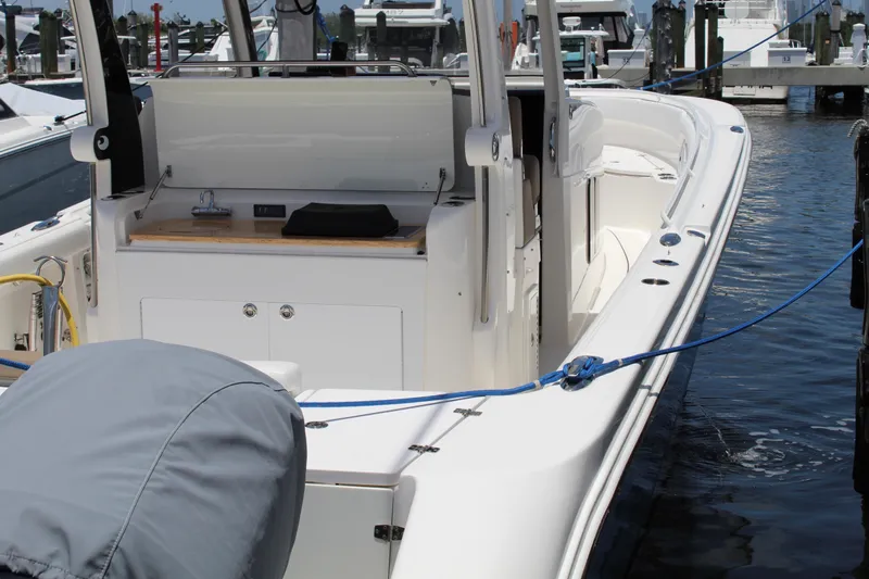  Yacht Photos Pics 2016 Edgewater 370CC boat docked, showcasing sleek design and spacious deck.