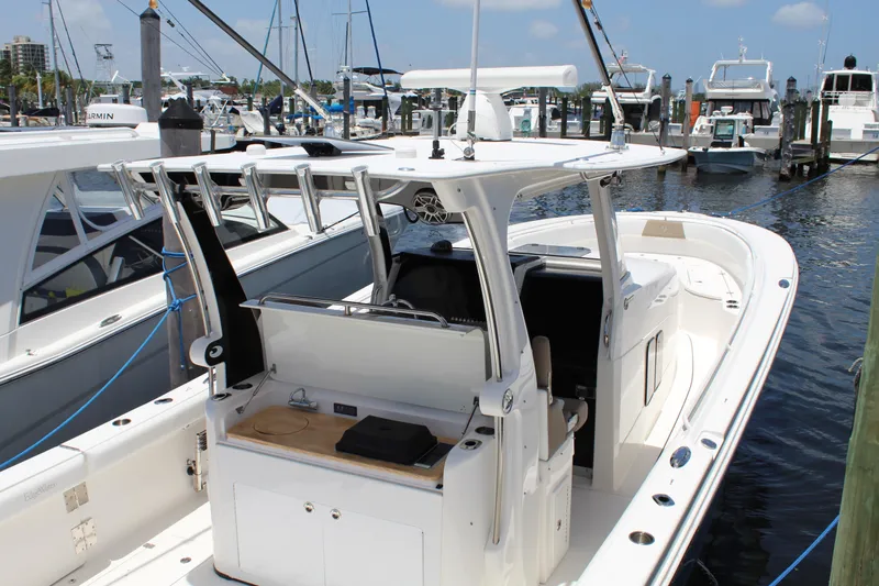  Yacht Photos Pics 2016 Edgewater 370CC boat docked at marina, featuring spacious deck and modern design.