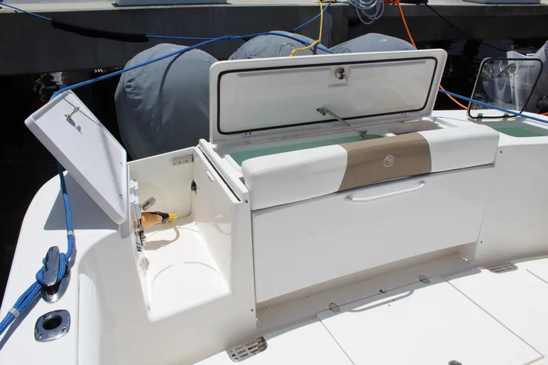  Yacht Photos Pics 2016 Edgewater 370CC boat with open storage compartments and seating area.