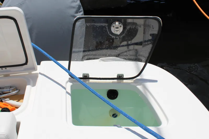  Yacht Photos Pics Open hatch on 2016 Edgewater 370CC boat with blue rope and water inside.