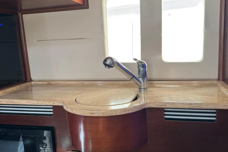  Yacht Photos Pics Luxurious kitchen area in 2016 Edgewater 370CC boat with modern sink and countertop.