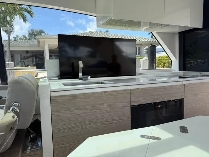  Yacht Photos Pics Luxurious interior of 2023 Rio Yachts SPORT COUPE with modern kitchen and sleek design.
