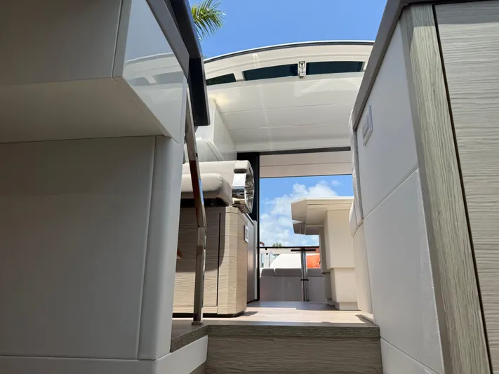  Yacht Photos Pics 2023 Rio Yachts SPORT COUPE interior with modern design and open sky view.