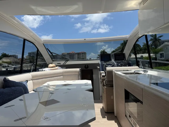  Yacht Photos Pics Luxurious interior of 2023 Rio Yachts SPORT COUPE with modern amenities and panoramic views.