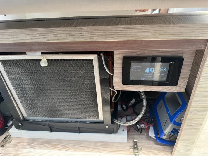  Yacht Photos Pics Control panel and equipment inside 2023 Rio Yachts SPORT COUPE, displaying temperature settings.