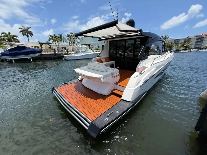  Yacht Photos Pics 2023 Rio Yachts SPORT COUPE docked, featuring sleek design and spacious deck.