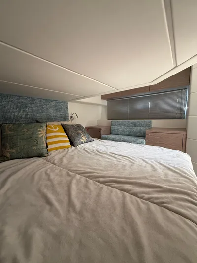  Yacht Photos Pics Luxurious bedroom interior of 2023 Rio Yachts SPORT COUPE with stylish bedding and cushions.