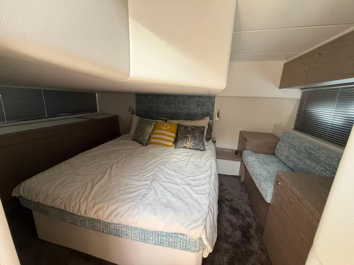  Yacht Photos Pics Luxurious bedroom interior of 2023 Rio Yachts SPORT COUPE with cozy bed and modern decor.
