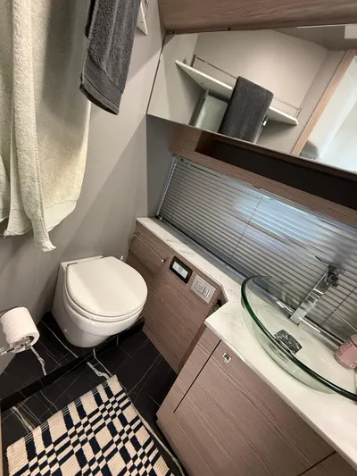  Yacht Photos Pics Modern bathroom in 2023 Rio Yachts SPORT COUPE with glass sink and sleek design.