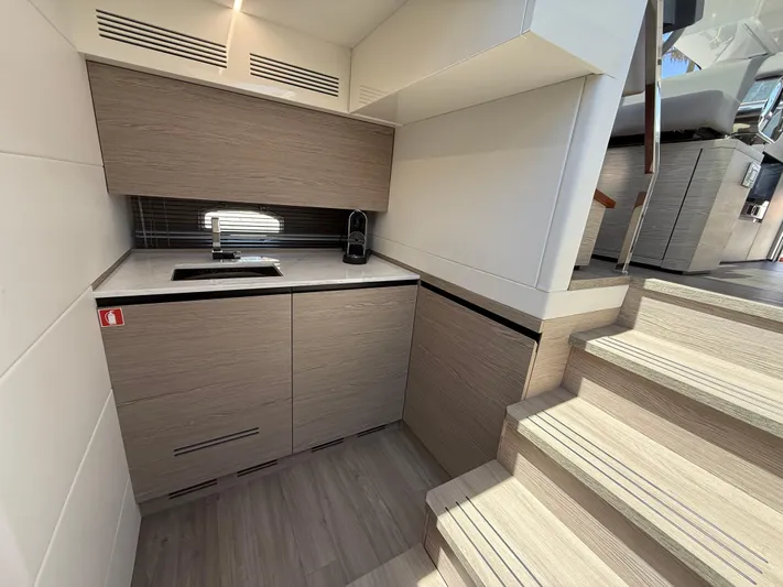  Yacht Photos Pics Modern kitchen area in 2023 Rio Yachts SPORT COUPE with sleek cabinetry and compact design.