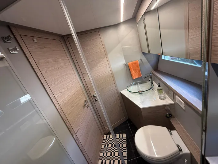  Yacht Photos Pics Luxurious bathroom in 2023 Rio Yachts SPORT COUPE with modern fixtures and elegant design.