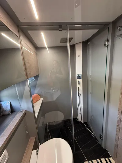  Yacht Photos Pics Modern bathroom in 2023 Rio Yachts SPORT COUPE with sleek design and glass shower.