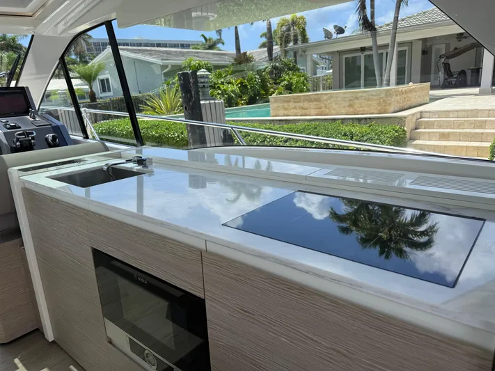  Yacht Photos Pics Interior of 2023 Rio Yachts SPORT COUPE with modern kitchen and scenic view.