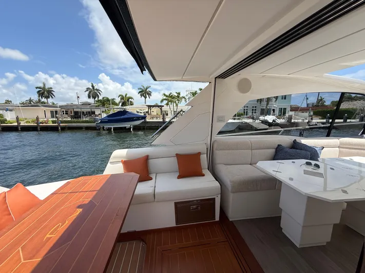  Yacht Photos Pics Luxurious 2023 Rio Yachts SPORT COUPE interior with elegant seating and waterfront view.