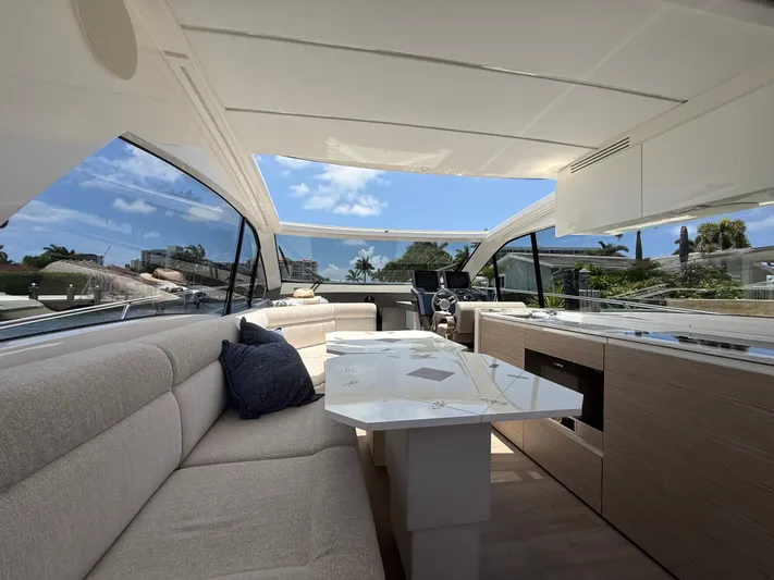  Yacht Photos Pics Luxurious interior of 2023 Rio Yachts SPORT COUPE with modern seating and panoramic windows.