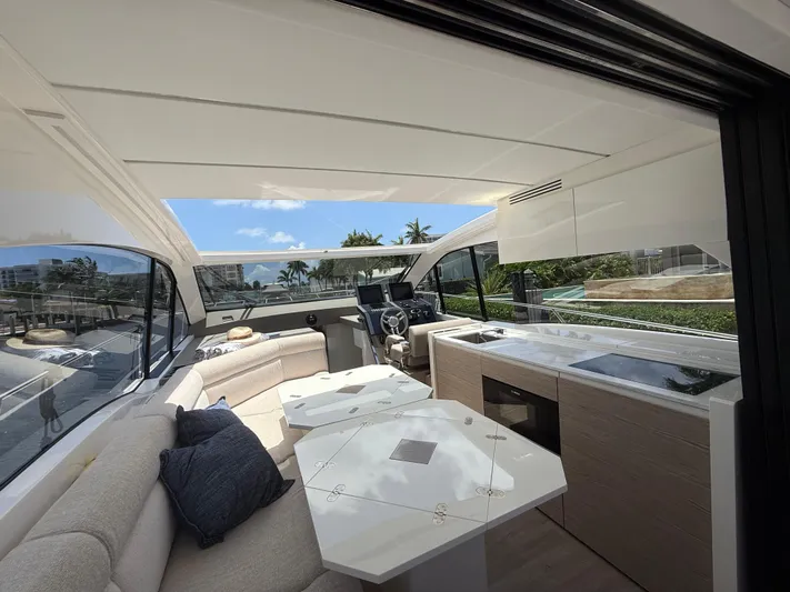  Yacht Photos Pics Luxurious interior of 2023 Rio Yachts SPORT COUPE with modern seating and kitchen area.