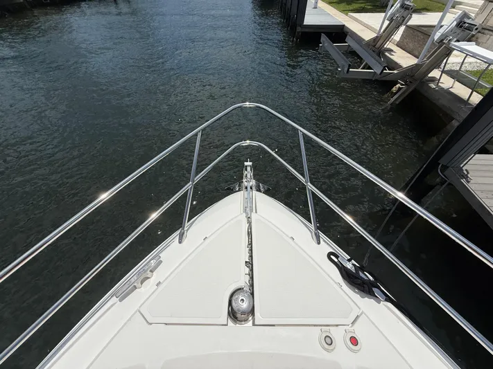  Yacht Photos Pics Bow view of 2023 Rio Yachts SPORT COUPE, docked in a marina.