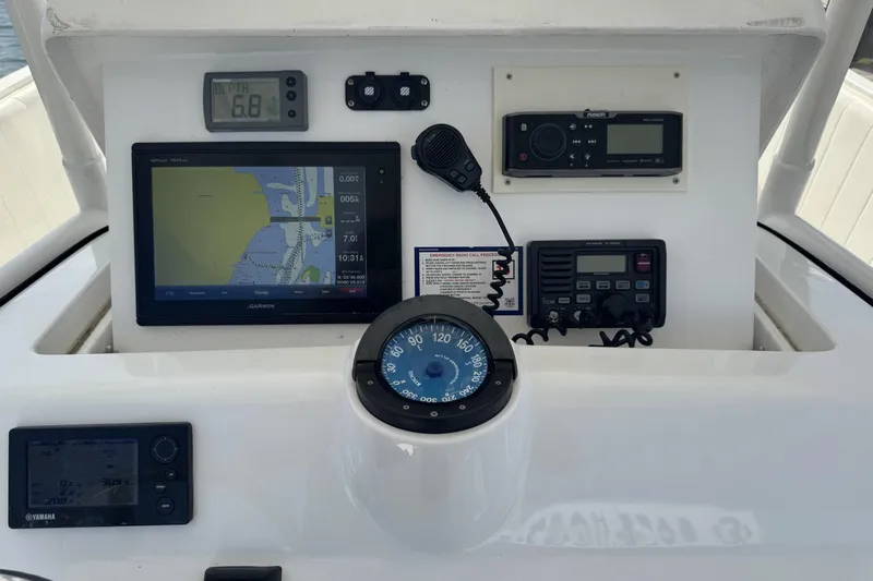  Yacht Photos Pics 2005 Intrepid 323 Cuddy dashboard with navigation and communication instruments.