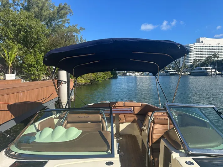  Yacht Photos Pics 2015 Chris-Craft Launch 32 boat on water with sunshade.