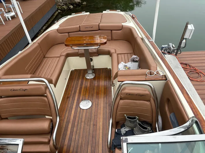  Yacht Photos Pics Interior of a 2015 Chris-Craft Launch 32 with brown leather seating.