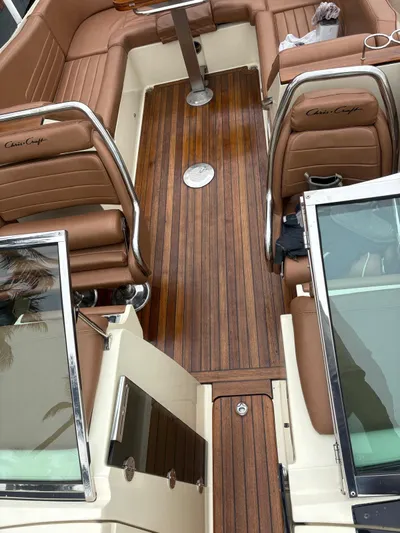  Yacht Photos Pics Interior of a 2015 Chris-Craft Launch 32 with wood flooring and leather seats.