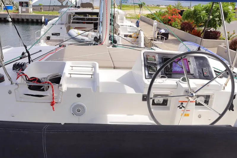 Libertas Ds Yacht Photos Pics 2019 Lagoon 450 F yacht cockpit with steering wheel and navigation controls.