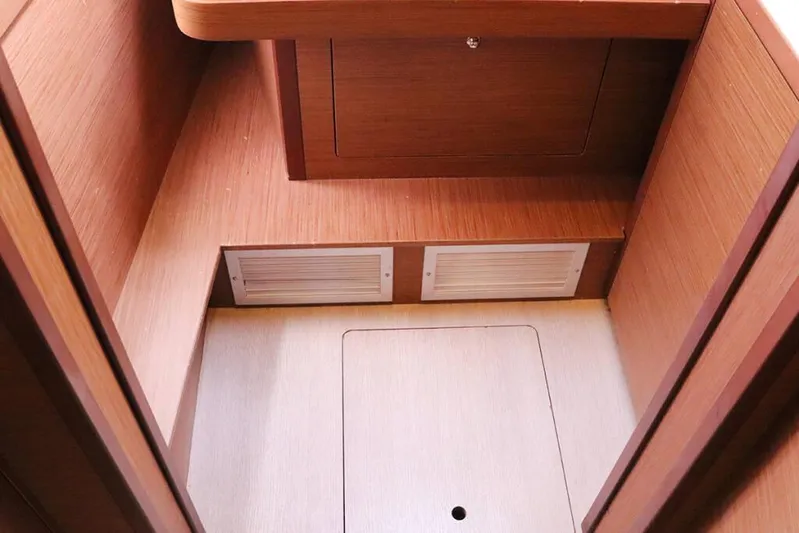 Libertas Ds Yacht Photos Pics Interior of 2019 Lagoon 450 F yacht, featuring wooden cabinetry and storage compartments.
