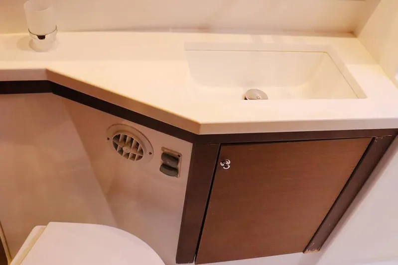 Libertas Ds Yacht Photos Pics 2019 Lagoon 450 F bathroom sink with wooden cabinet and modern design.