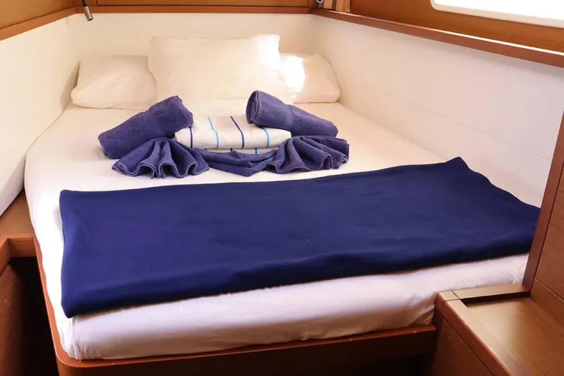 Libertas Ds Yacht Photos Pics Cozy cabin bed in 2019 Lagoon 450 F yacht with neatly arranged blue towels.