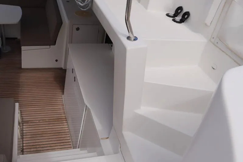 Libertas Ds Yacht Photos Pics 2019 Lagoon 450 F yacht interior with sleek white design and wooden flooring.